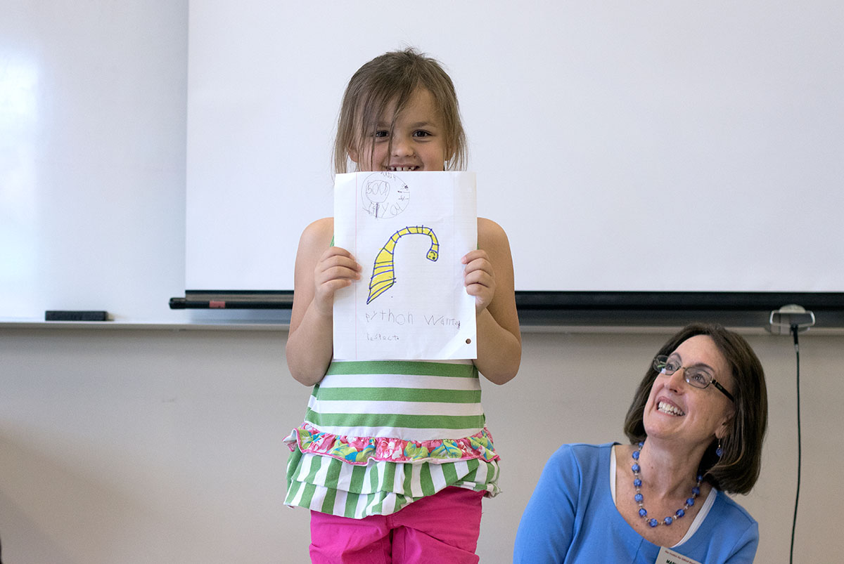 Caroline Wimpee shows off her project in Language Arts Tuesday, June 6. After reading a folk tale, students chose from four different activities to complete. (Photo by Brook Joyner)