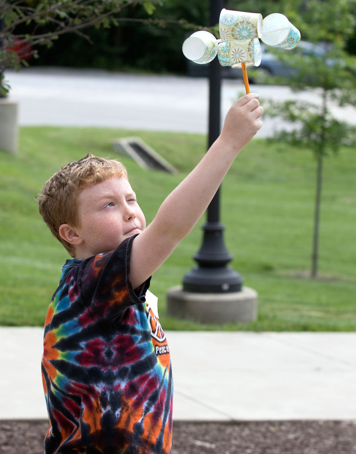 Henry Hulan holds his handmade anemometer in the air to measure the wind speed Thursday, June 8. Camp Explore students spent the week learning all about weather in Science. (Photo by Brook Joyner)