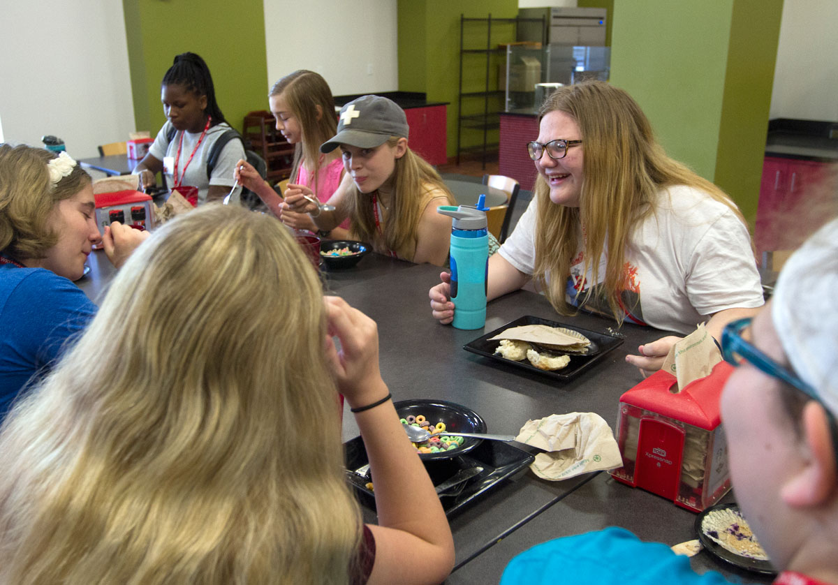 Kandi Rogers from Owensboro laughs with her hallmates during breakfast at Fresh Food Company Tuesday, June 13. (Photo by Sam Oldenburg)