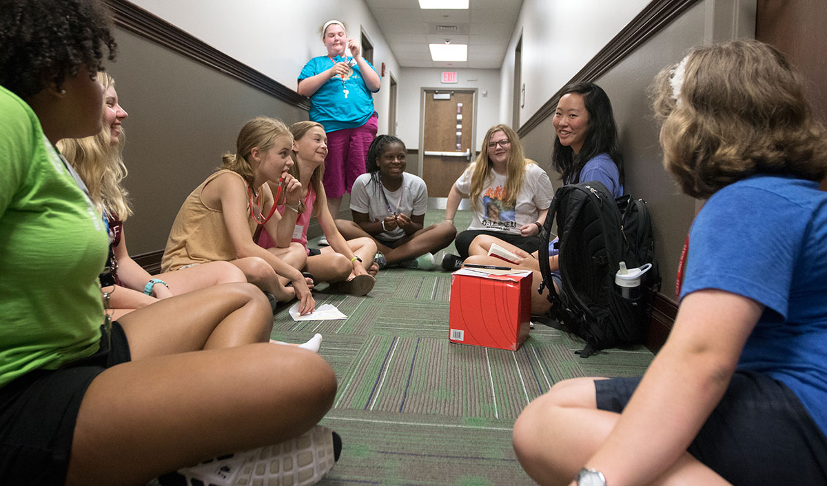Priscilla Suh meets with her campers after their classes Tuesday, June 13. The campers then had the chance to choose their optionals for the evening. (Photo by Brook Joyner)