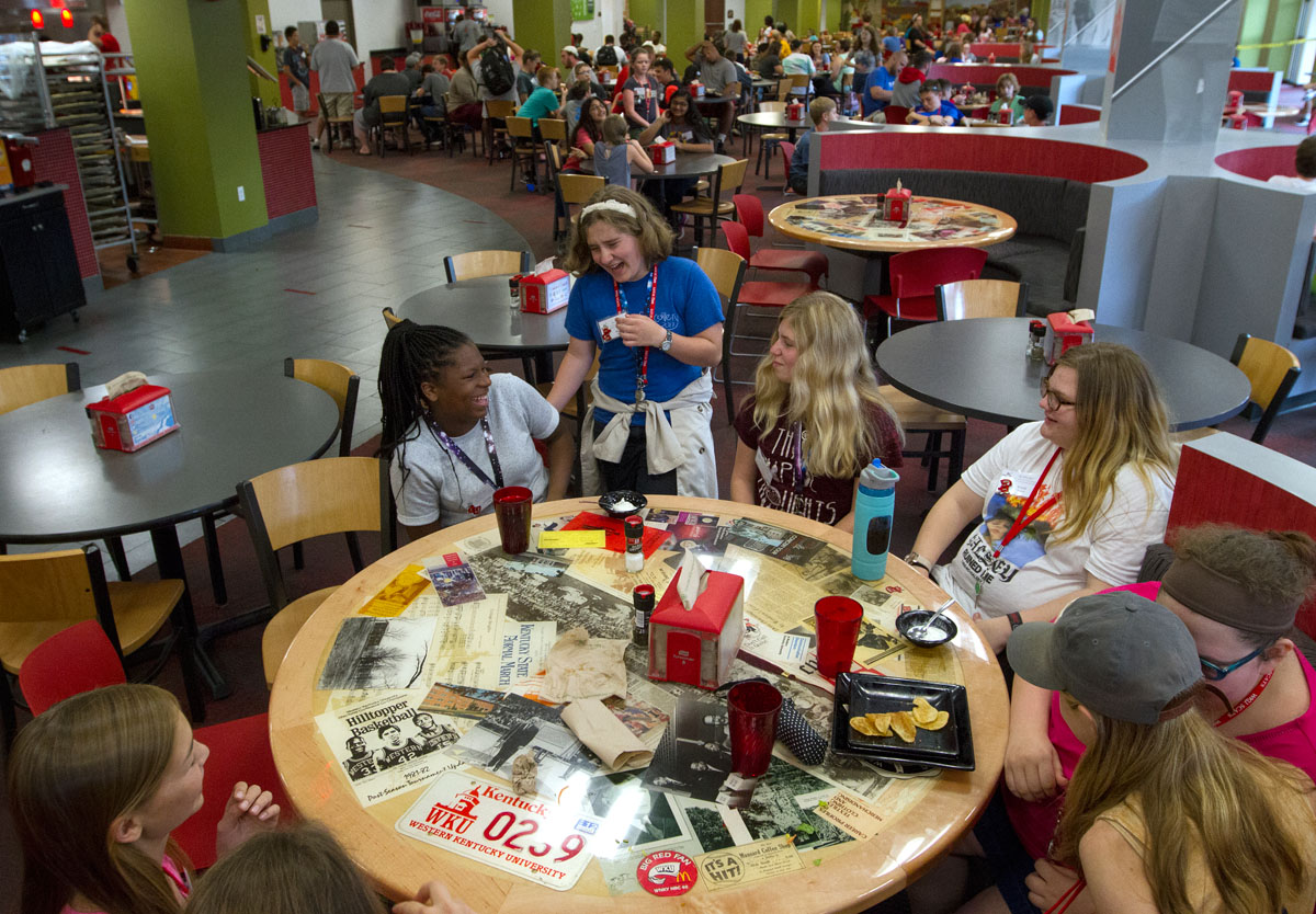 Campers in Priscilla Suh's group visit after eating dinner in Fresh Food Company Tuesday, June 13. (Photo by Sam Oldenburg)