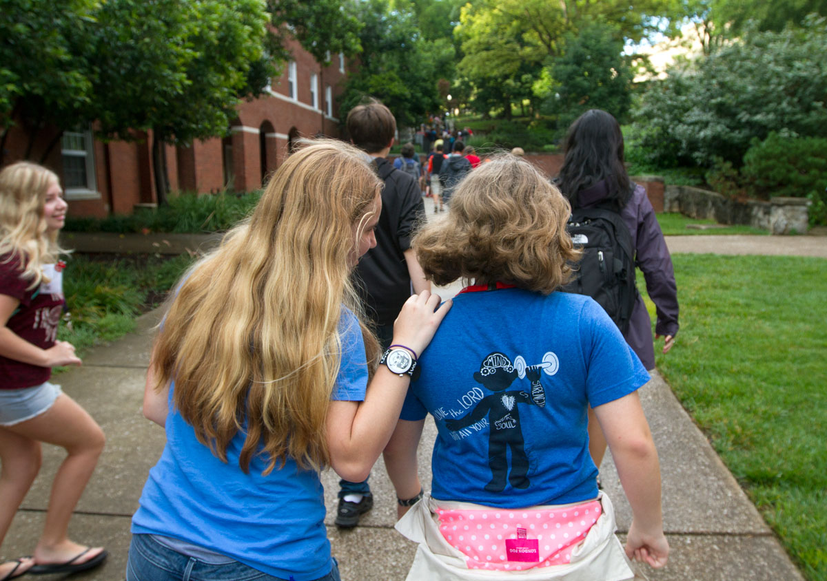Eden Casebier (left) of Bowling Green talks with Megan Batson from Cookeville, Tenn., on their way back to Florence Schneider Hall after dinner Tuesday, June 13. (Photo by Sam Oldenburg)