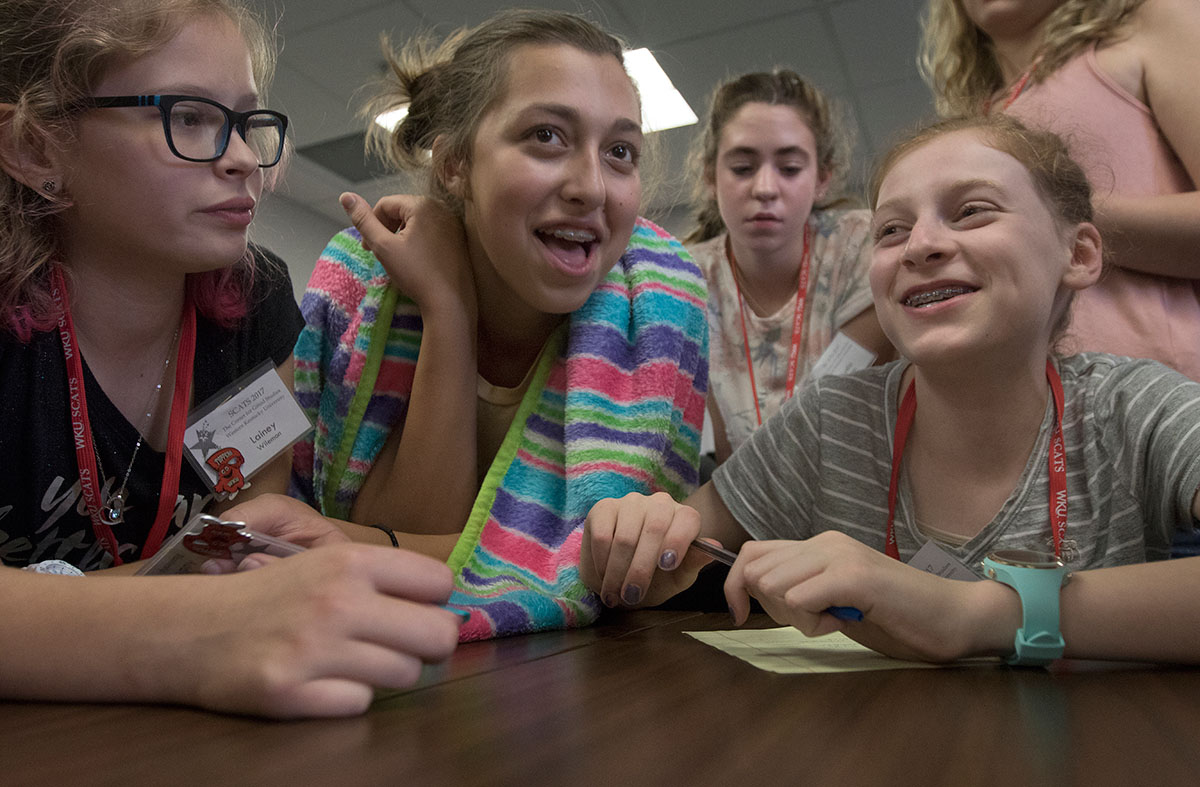 Lainey Wilemon (from left) of Saint Petersburg, Fla., Addie Blankenship of Birmingham, Ala., and Lindsay Whitaker of Lexington play Scamper Feud during optionals Tuesday, June 13. Two teams of campers competed against one another in a modified version of Family Feud. (Photo by Brook Joyner)