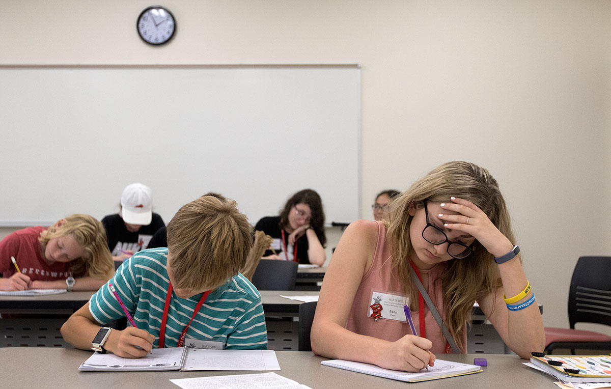 David Abel (left) of Owensboro and Bella Karn of Whitesville work on their short stories at the beginning of Future Authors on Tuesday, June 13. Each day the students start writing a story and will eventually choose one to finish for their final project. (Photo by Brook Joyner)