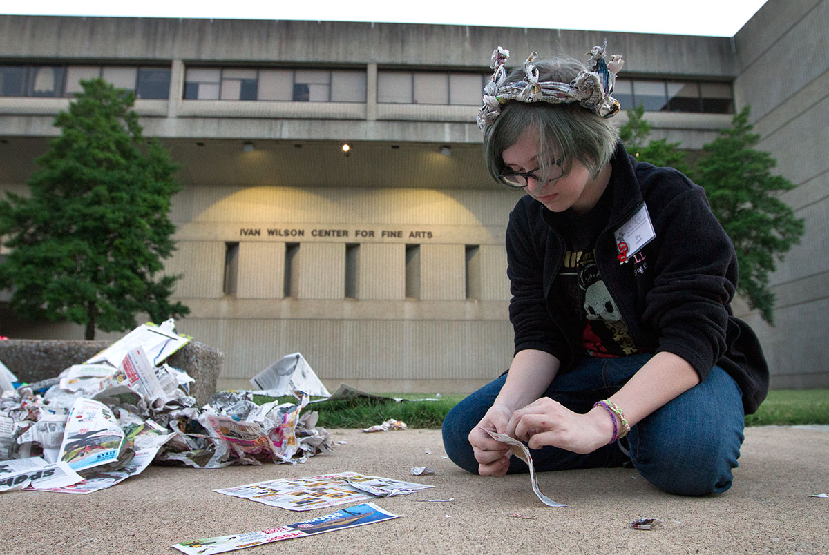 Ellie Ratliff of Louisville makes a mask out of newspaper during the Target Acquired optional Wednesday, June 14.  (Photo by Sam Oldenburg)