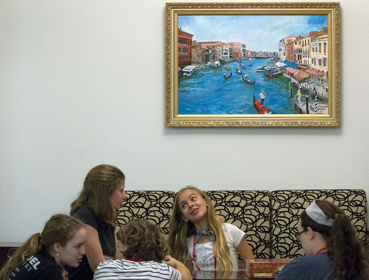 Mac Bettersworth (center) of Bowling Green visits with fellow campers in the lobby of Florence Schneider Hall during optional time Wednesday, June 14. (Photo by Sam Oldenburg)