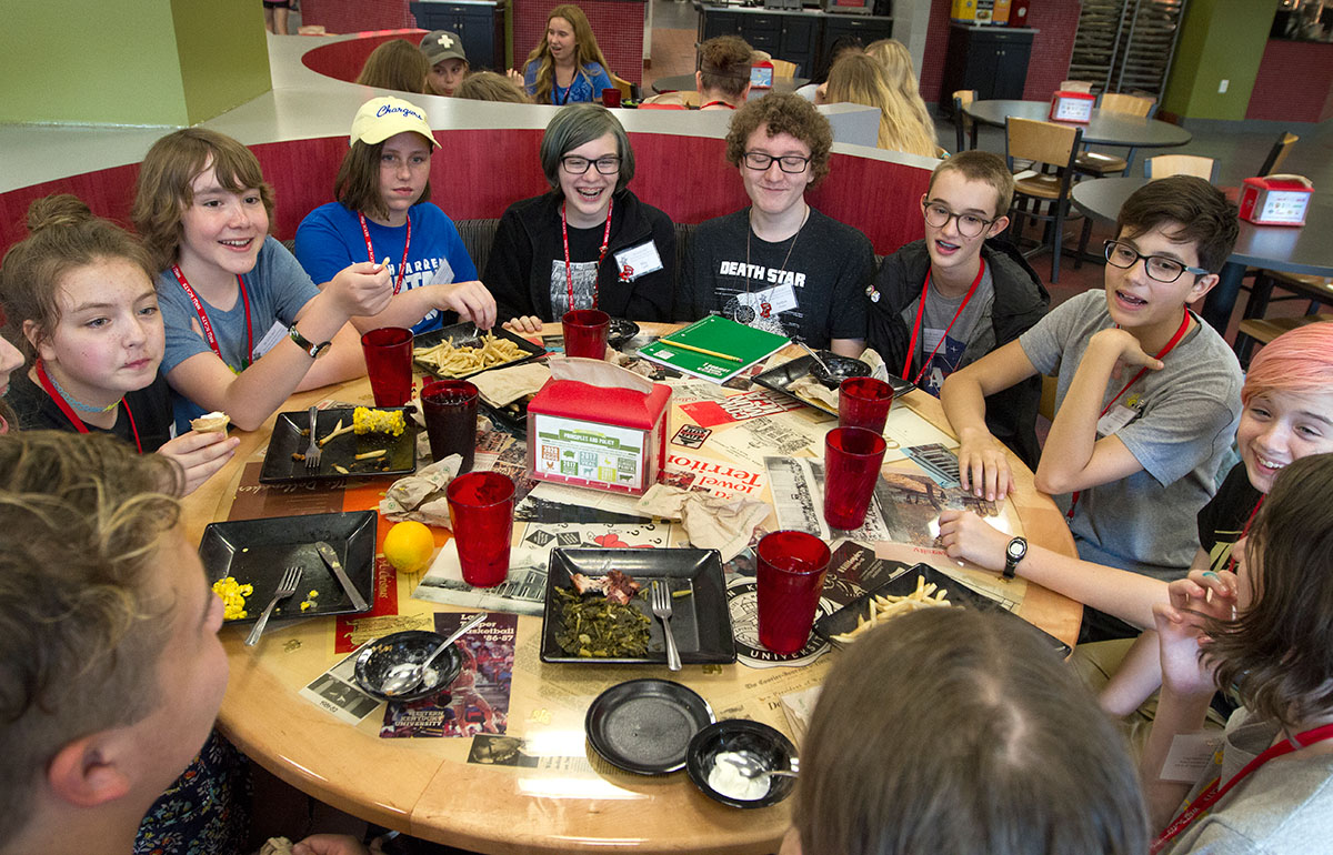 SCATS campers visit with each other after eating dinner in Fresh Food Company Tuesday, June 13. (Photo by Sam Oldenburg)