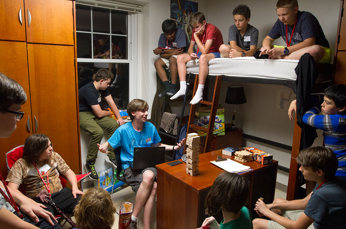 Counselor Ben Guthrie leads his campers in a storytelling game he created during hall time in his room in Florence Schneider Hall Monday, June 19. (Photo by Sam Oldenburg)