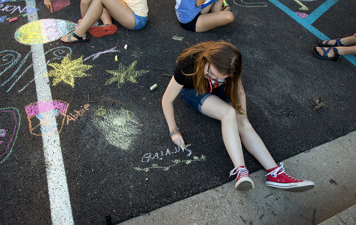 Abbie Camp of Mount Sterling joins other campers for the chalk drawing optional Tuesday, June 27. (Photo by Brook Joyner