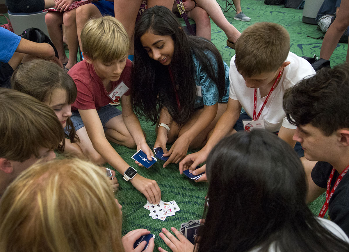 David Abel (left) of Owensboro and Hannah Jawed of Corbin play cards with other campers during community time in Florence Schneider Hall Monday, June 26. (Photo by Sam Oldenburg)