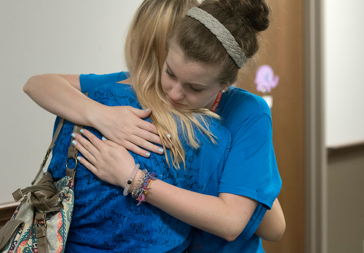 Emma North of Owensboro hugs Evie Ellis of Russellville during check-out Friday, June 23. Emma and Evie lived on the same hall and spent a lot of time together. (Photo by Brook Joyner)