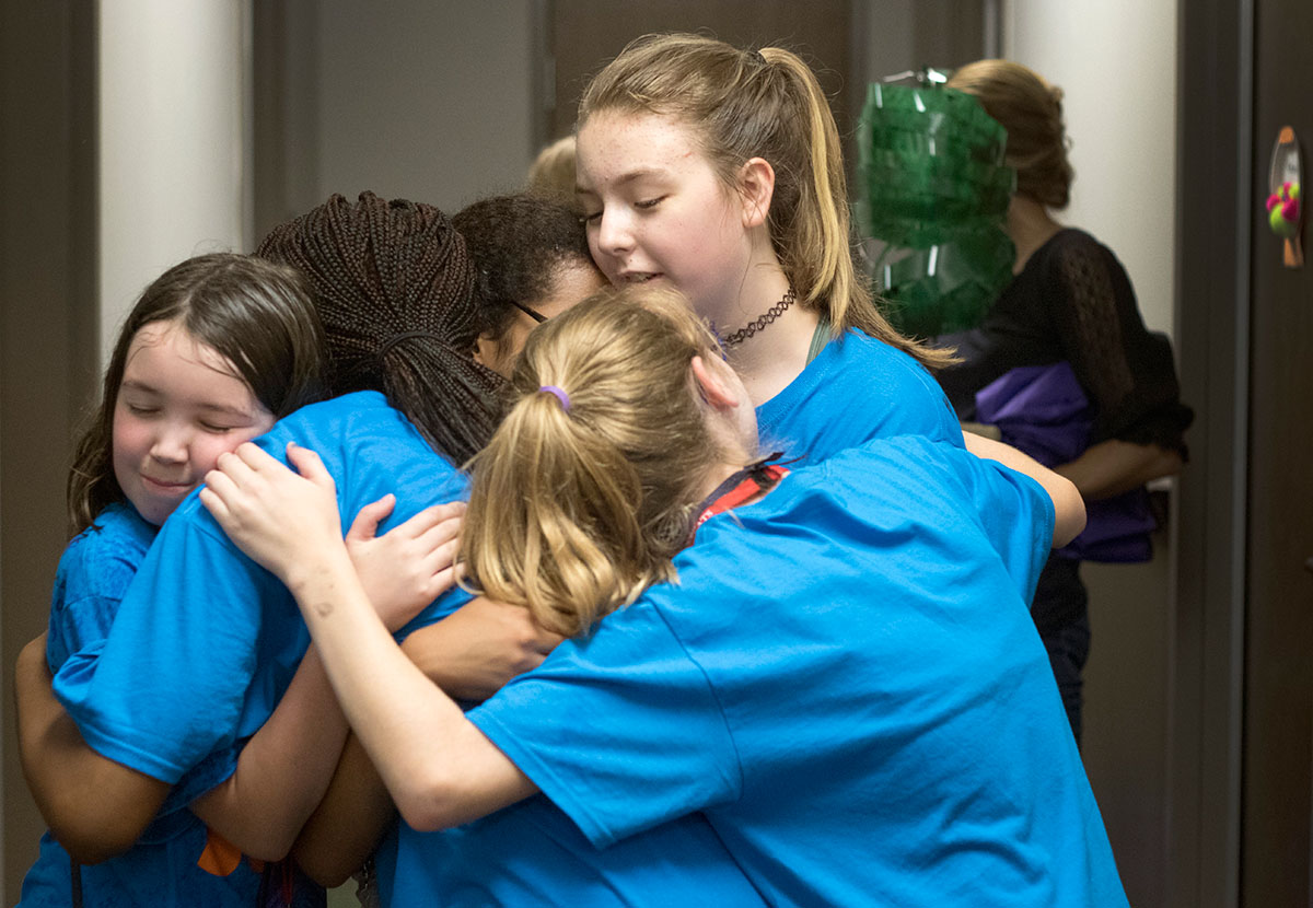 A group of girls from the fourth floor hug goodbye on the last day of SCATS Friday, June 23. Campers spent a lot of time with their counselor groups and got to know one another well over the two weeks. (Photo by Brook Joyner)
