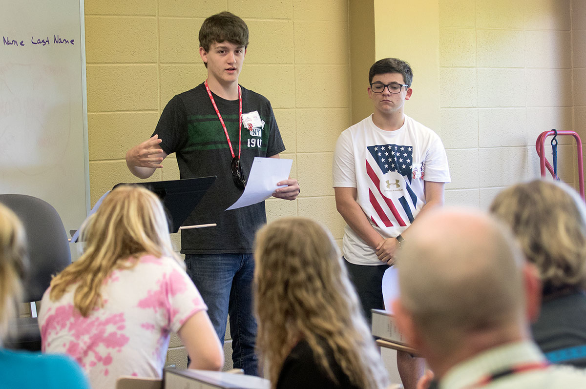 Ben Bozza (left) of Greenbrier, Tenn. and Hayden Teeter of Brentwood, Tenn. present on the first day of Nazi Germany and the Holocaust Monday, June 26. Students paired up and got to know one another and then introduced their partner to the class. (Photo by Brook Joyner)