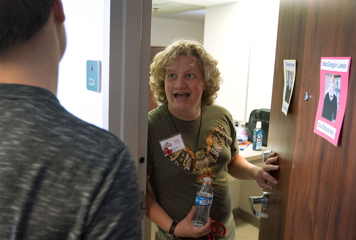 MacGregor Lakes from Berea talks with a hallmate outside his room in McLean Hall Monday, June 26. (Photo by Sam Oldenburg)