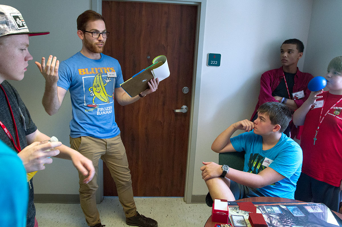 Counselor Max Tague holds a meeting in McLean Hall with the boys in his group Monday, June 26. Counselors hold hall meetings every afternoon after students return from classes. (Photo by Sam Oldenburg)