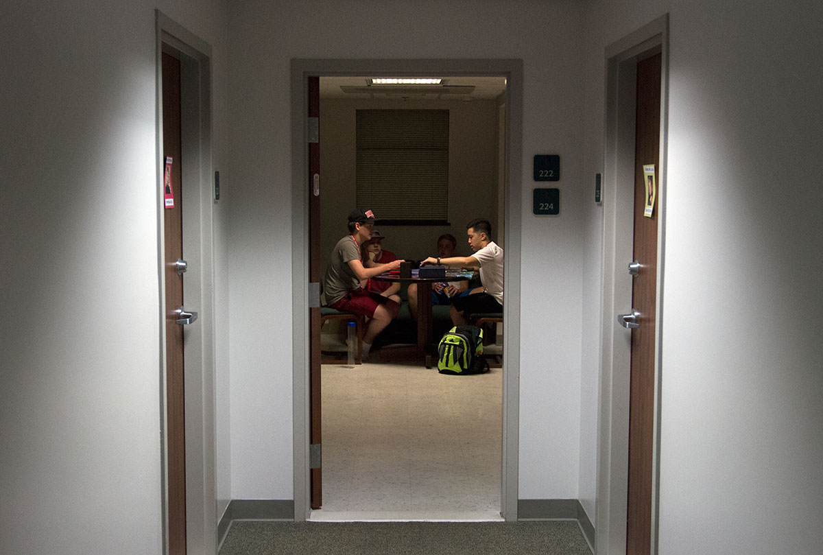 Ben Bozza (left) of Greenbrier, Tenn., and Scott Dinh of Louisville play Magic the Gathering in McLean Hall during hall time Monday, June 26. (Photo by Sam Oldenburg)