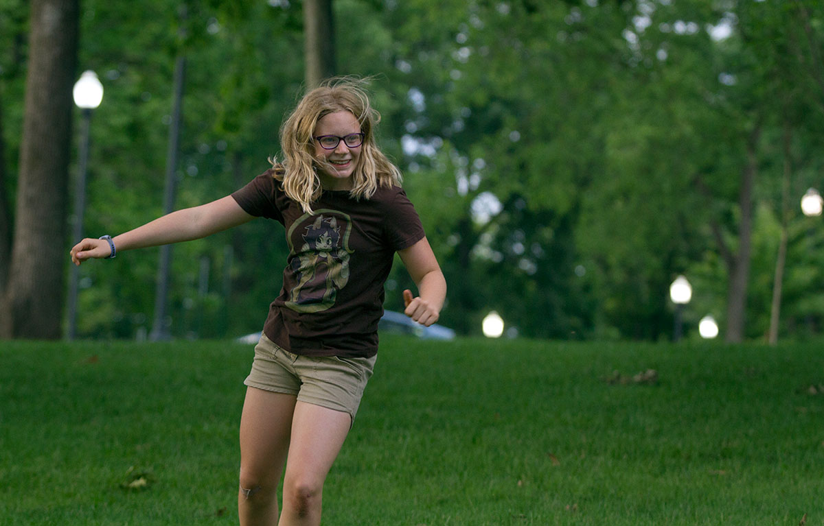 Abby Adams-Smith of Bowling Green chases after another camper in a game of Humans vs. Zombies during optional time Monday, June 26. Humans used pool noodles to defend themselves from zombies. (Photo by Sam Oldenburg)