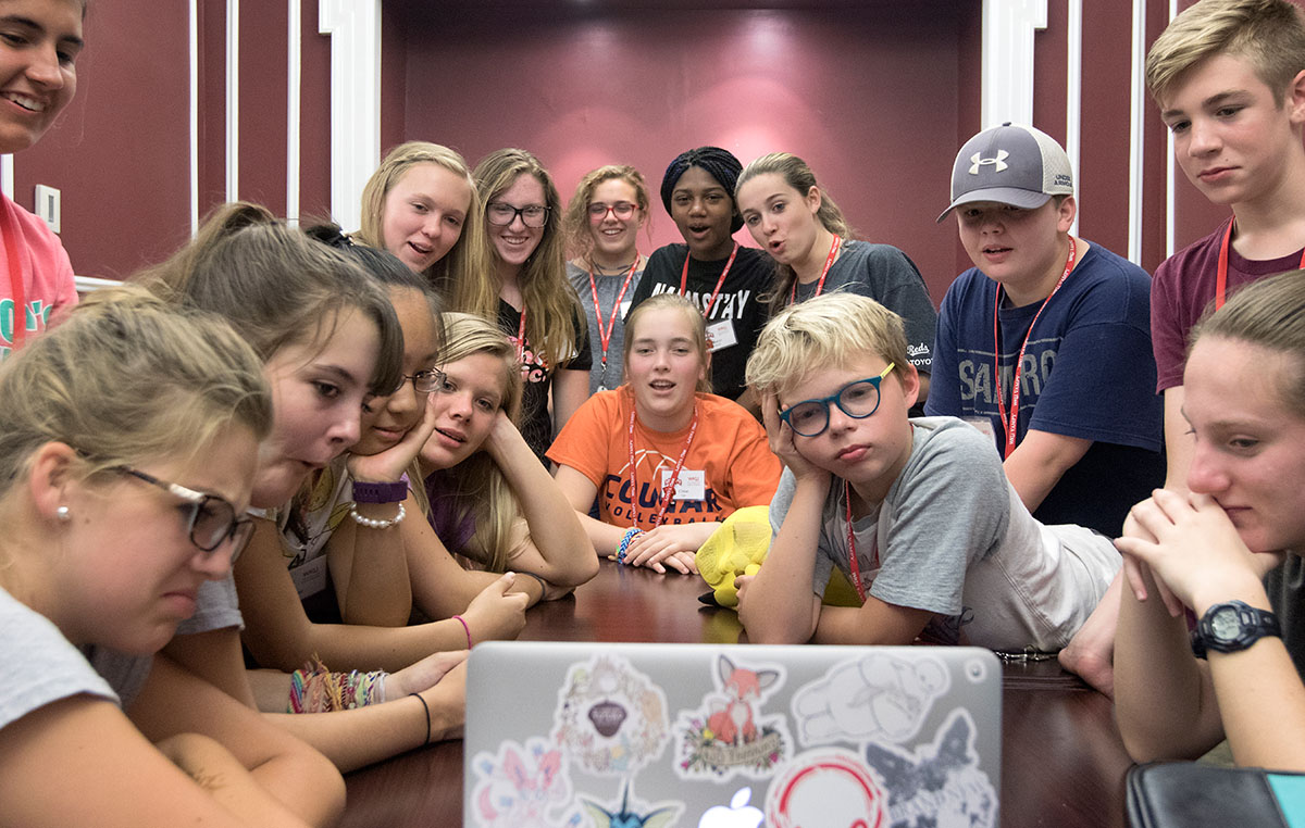Campers watch "American Ninja Warrior" during optionals Wednesday, June 28. After watching the video, they competed in an obstacle course set up outside. (Photo by Brook Joyner)