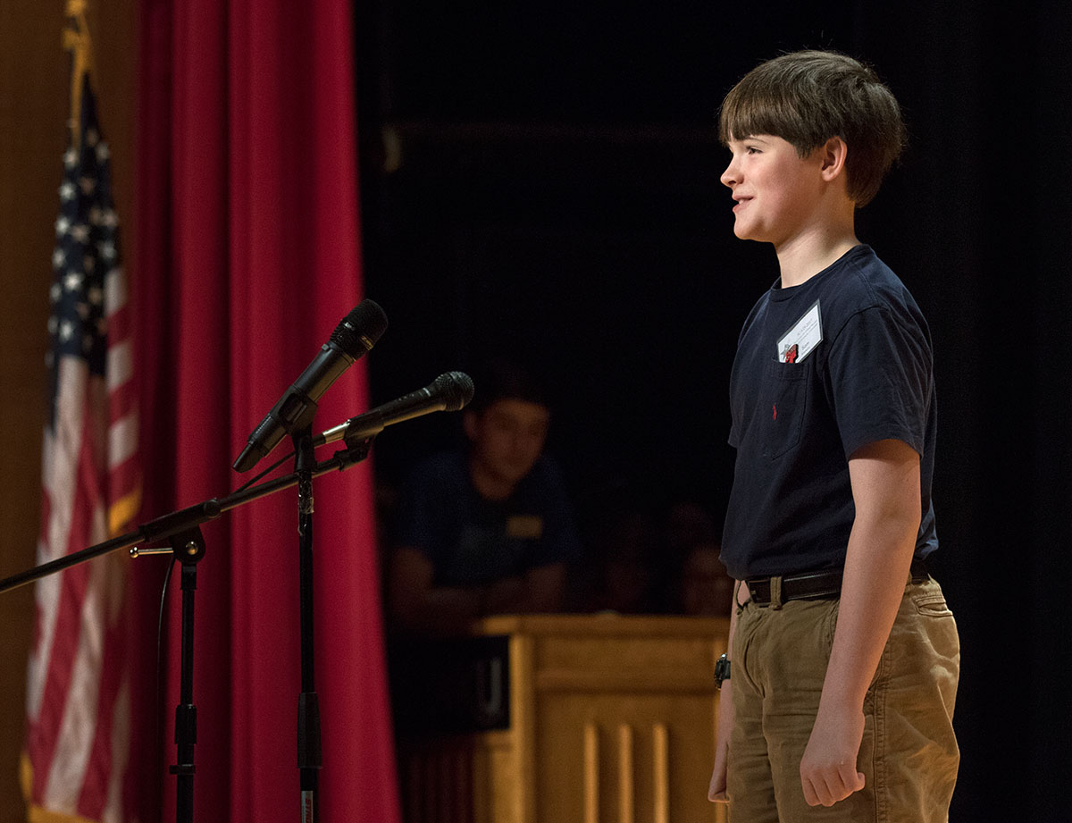 Sam Kanaly of Louisville performs a short comedy routine for the talent show Wednesday, June 21. Other campers sang, played instruments, jumped rope and danced. (Photo by Brook Joyner)