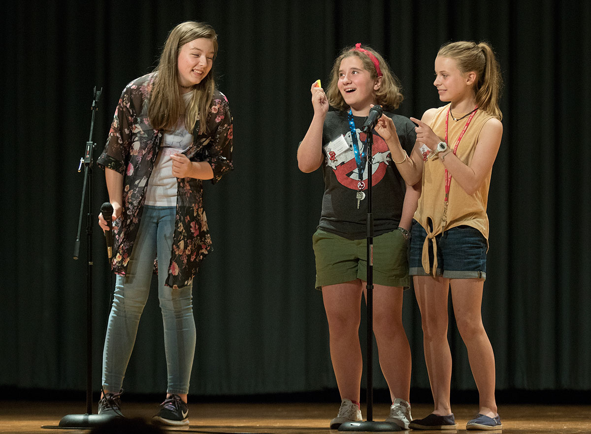 Kendall Pullam (from left) of Henderson, Megan Baston of Cookeville, Tenn., and Mary Margaret Vickers of Henderson perform a rendition of "Bohemian Rhapsody" Wednesday, June 21. Kendall sang while Megan and Mary Margaret played kazoos. (Photo by Brook Joyner)