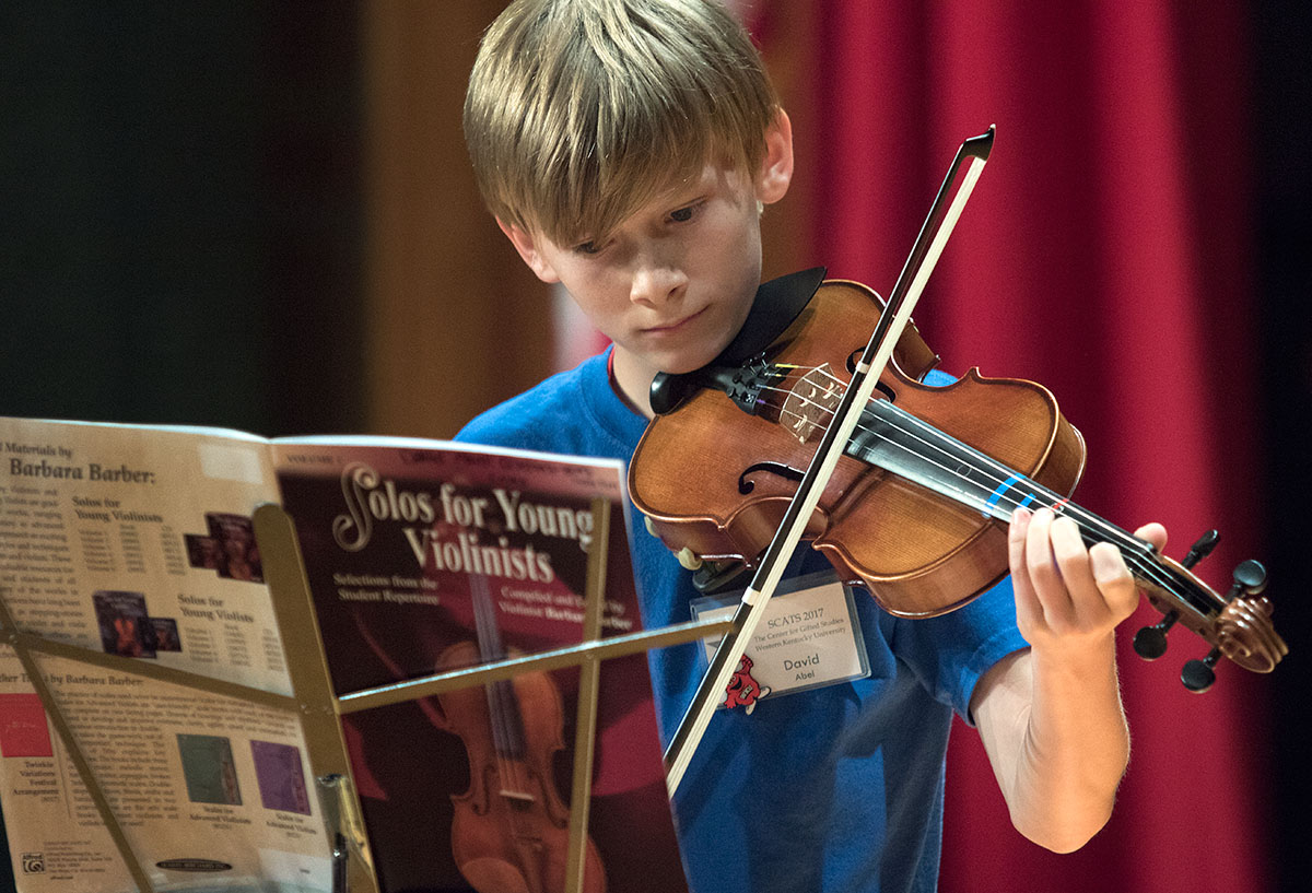 David Abel of Owensboro plays violin during the annual SCATS talent show Wednesday, June 21, in the Downing Student Union. David performed "Concerto in D Major." (Photo by Brook Joyner)
