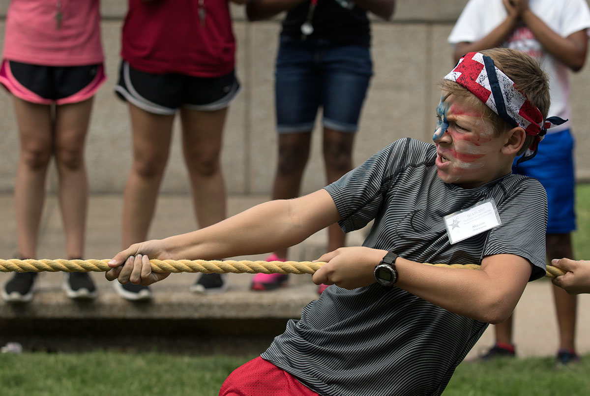 Mason Shacklette of Smiths Grove competes in tug-of-war during SCATS Olympics Saturday, June 17. While many of the events were athletic, there was also trivia, story time and crafts. (Photo by Brook Joyner)