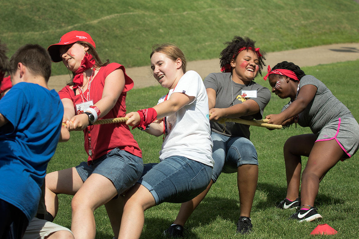 Team Canada competes in tug-of-war during SCATS Olympics Saturday, June 17. Canada ended took second place in the tug-of-war competition. (Photo by Brook Joyner)