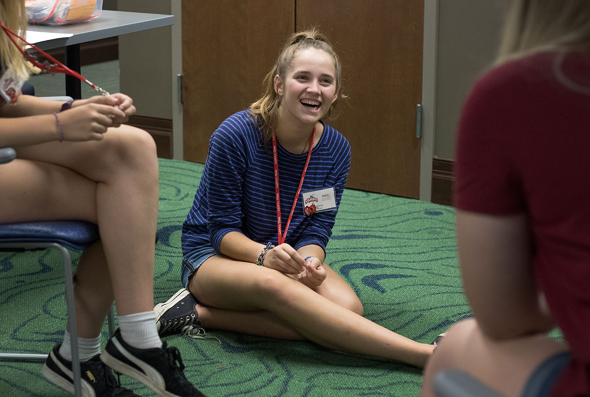 Mary Baker of Paducah visits with the other girls in her counselor group after moving in Sunday, June 25. Because she attended SCATS in previous years, Mary already knew many people at VAMPY. (Photo by Brook Joyner)