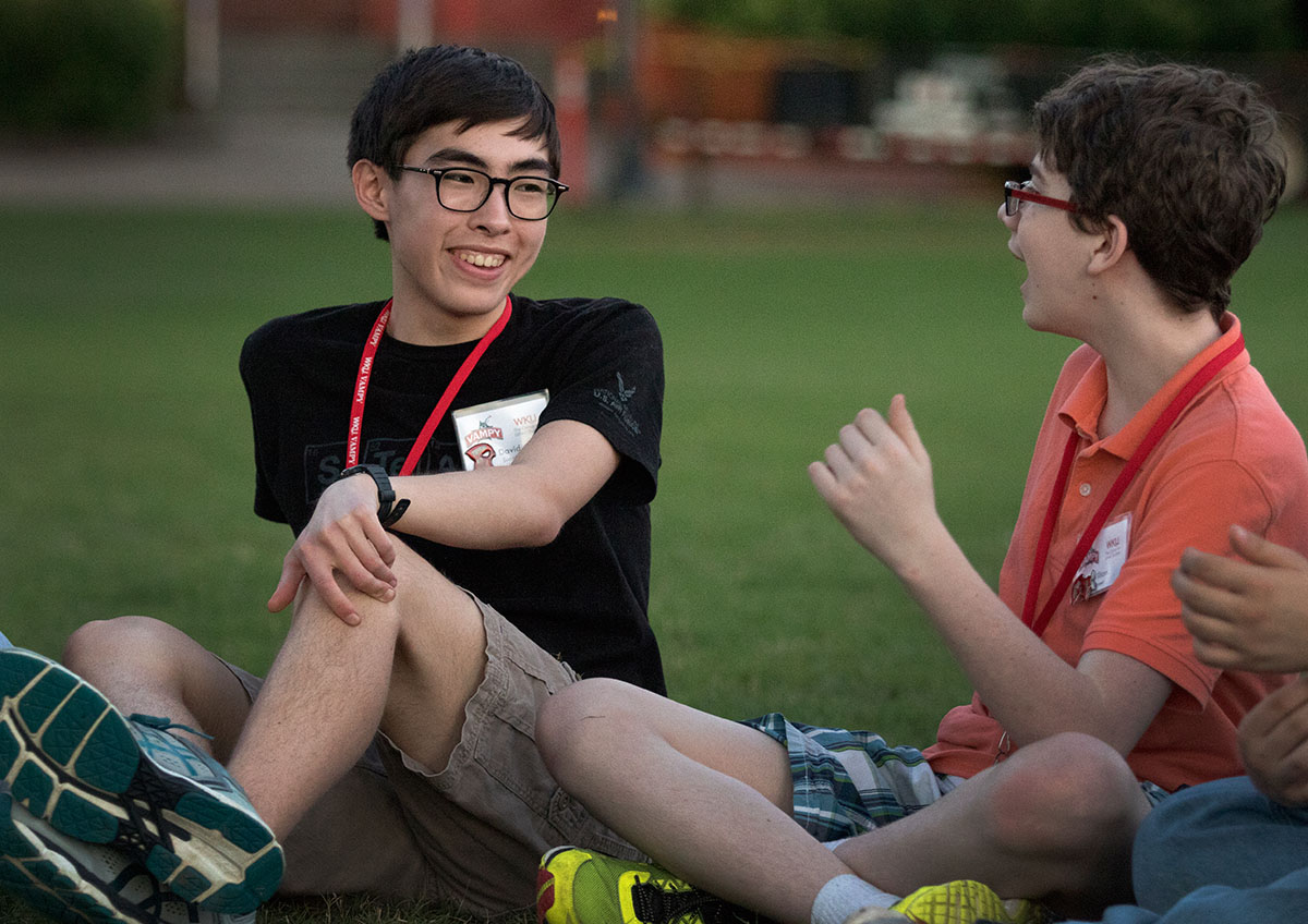 David Suarez (left) of Somerset talks with William Poteet of Bowling Green on the opening day of camp Sunday, June 25. Campers rotated around a series of icebreaker activities to get to know one another better. (Photo Brook Joyner)