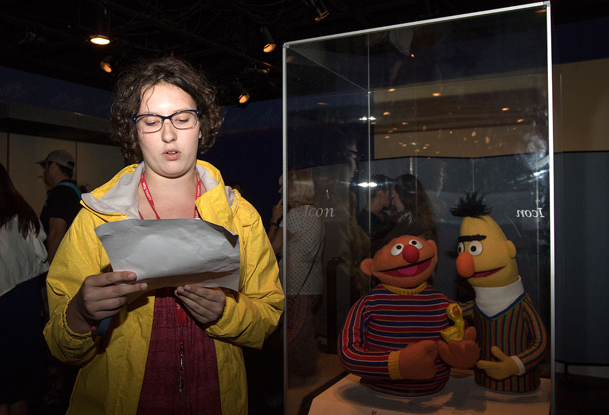 Emma Simpson of Bowling Green reads her report while standing next to original Bert and Ernie puppets from Sesame Street at the American History Museum in Washington D.C. Thursday, July 6. Before the field trip, Emma and her Pop Culture classmates each chose an artifact in the museum and wrote a short research paper about the history and significance of the object. (Photo by Brook Joyner)
