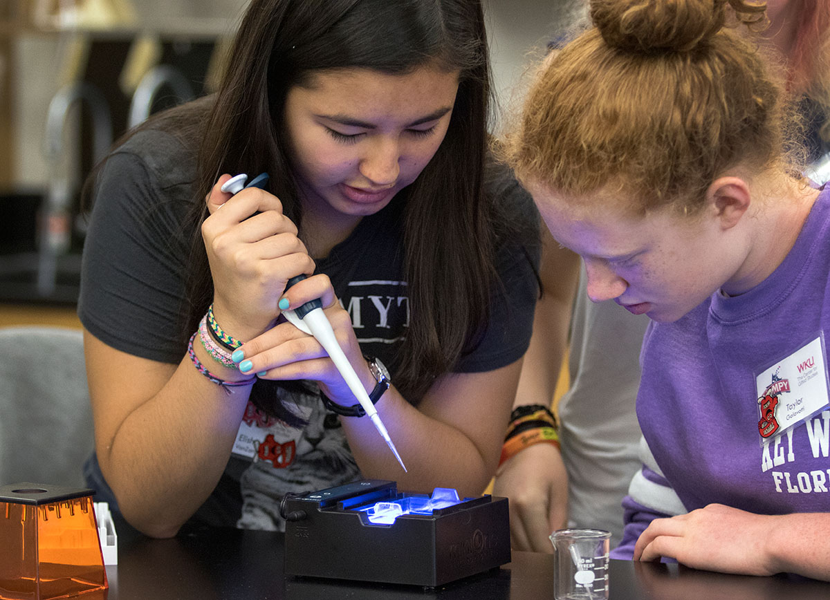 Elisha VanZant and Taylor Galavotti, both from Lexington, work on an electrophoresis lab in DNA and Genetics Wednesday, July 5. Groups worked together to determine genetic relations based on DNA samples they were given. (Photo by Brook Joyner)