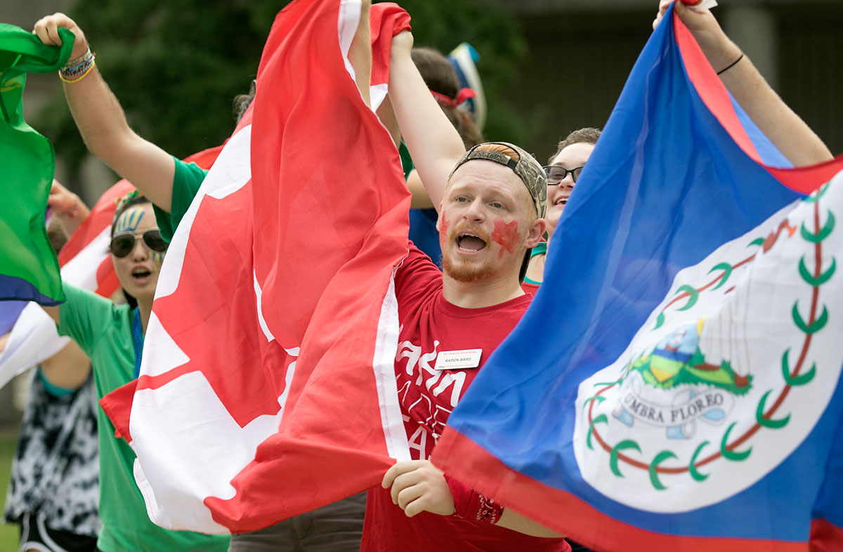 Aaron Bard cheers alongside fellow counselors following the opening ceremonies of VAMPY Olympics Saturday, July 1. Aaron was one of two counselors representing team Canada. (Photo by Brook Joyner)