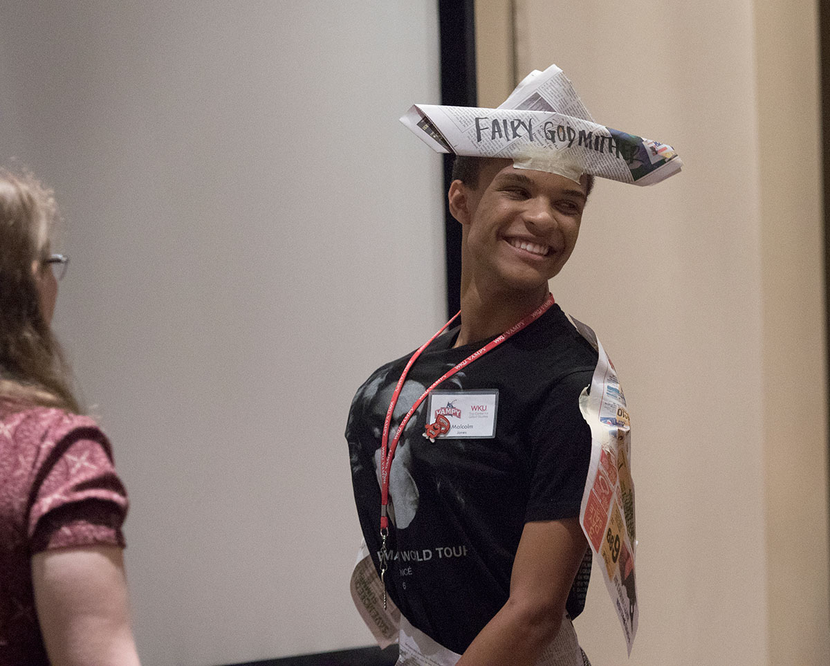 Malcolm Jones of Louisville plays the role of Fairy Godmother in the paper theater version of Cinderella Saturday, July 1. Each group had 30 minutes to plan a skit and make costumes and props entirely from newspaper. (Photo by Brook Joyner)